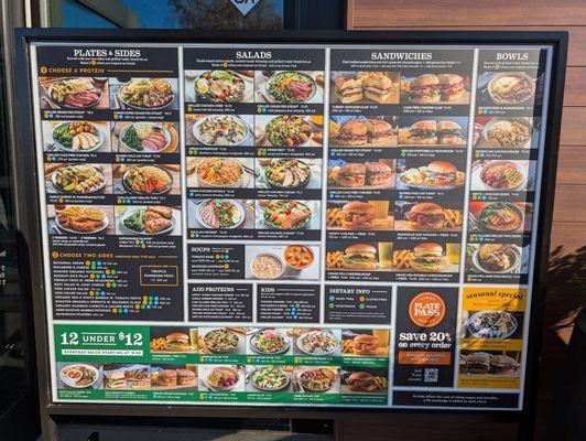 Full size menu poster with photos of the food to be offered when they open on the 12th.