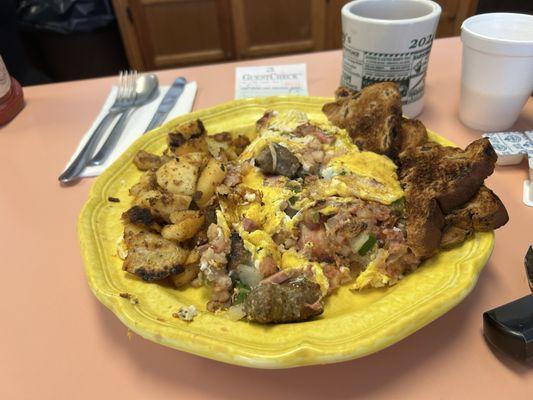 Meat, lovers omelette consist of diced ham, sausage, bacon, corn, beef, hash, diced onion, and green pepper and American cheese