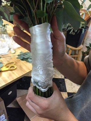 The handle on this bouquet was wrapped with a piece of her mom's wedding dress