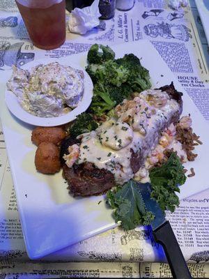 Grilled New York Strip with seafood etouffee, Sautéed broccoli & home made potato Salad.