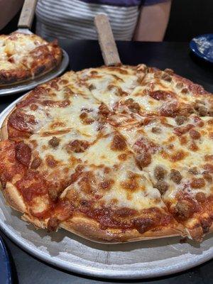 Medium pepperoni and ground beef pizza