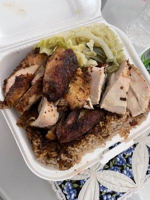 Large plate with rice and peas with cabbage with white jerk chicken