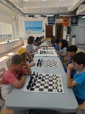 Fencing camp with chess.