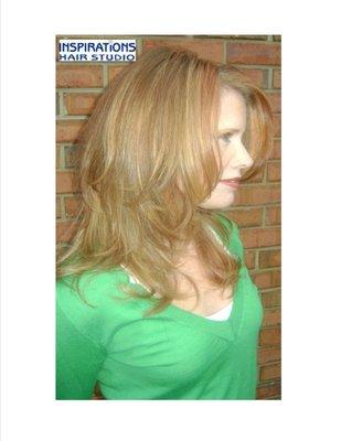 Vertical long layered cut. Highlighted hair with light blonde and copper hues