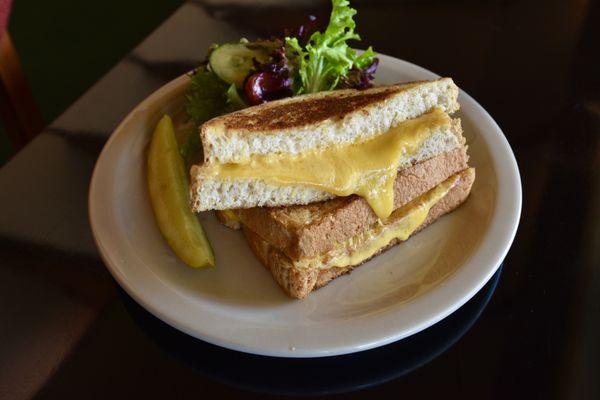 Grilled Cheese Sandwich 
with Aged Cheddar on Multi Grain Bread
and Seasonal Greens