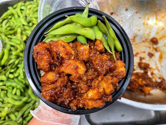 Spicy candied popcorn chicken over white rice & edamame. From the daily special menu.