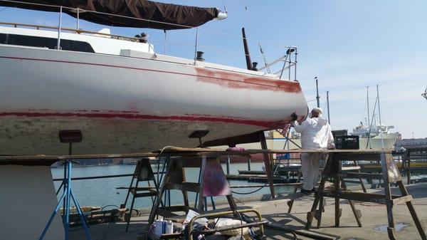 Alex doing some sanding work.