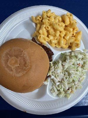 Chopped beef sandwich with Mac and cheese and coleslaw