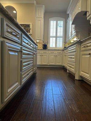 Stain to paint kitchen cabinetry. Fine finish work requires lots of detail. Look how smooth the cabinetry turned out.