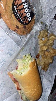 Jjblt with cheese and avacado, chocolate chip cookie, and jimmy chips