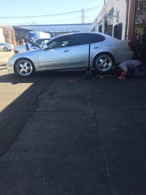 Employee used wood blocks to help fit a jack under my lowered car. Gave him a tip for the extra work to lift the car