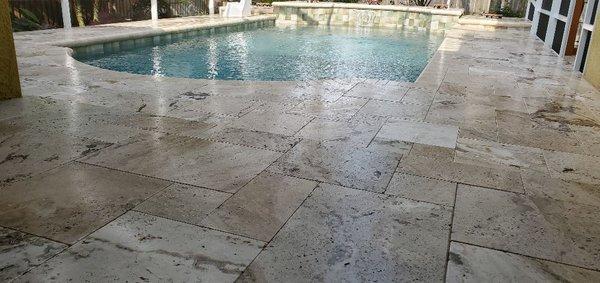 Newly sealed travertine deck. Shark Grip added to prevent slipping.