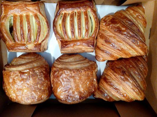 Chocolate croissant bottom left, Dulce de leche on the top left. Regular croissants to your right