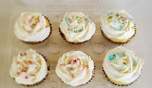 Gender cupcakes almond flavor with vanilla buttercream frosting pink and blue sprinkles