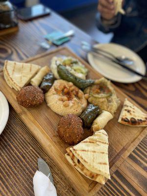 Excellent appetizer plate - falafel, hummus, tzaziki, baba ghanoush were all terrific