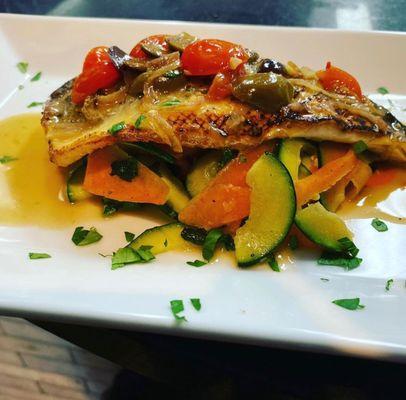 Branzino over sauteed vegetables