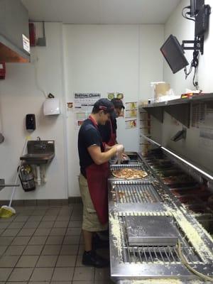 Shane and Jonathan working hard to make great pizzas.