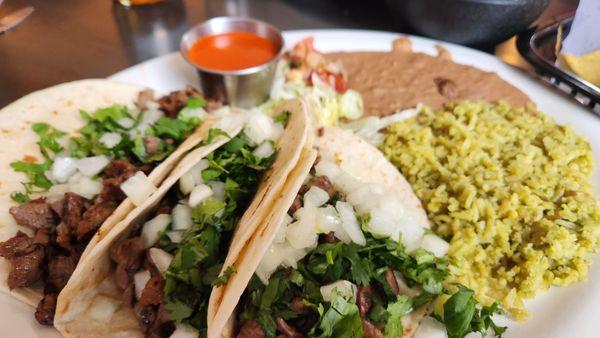 Carne asada tacos with rice and beans