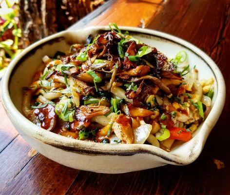 Bourbon Bacon Drunken Noodle topped with Foraged Mushroom Medley