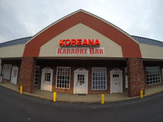 Koreana Karaoke Front Door  located at the far end of the shopping complex on the right