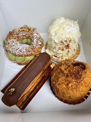 Pistachio Paris Brest, White Chocolate Merveilleux (Mythique), Speculoos Merveilleux (Majestueux), and Chocolate Eclair