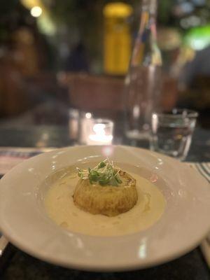 Cheese souffle floating in a sea of parmesan truffle cream. Simply divine!