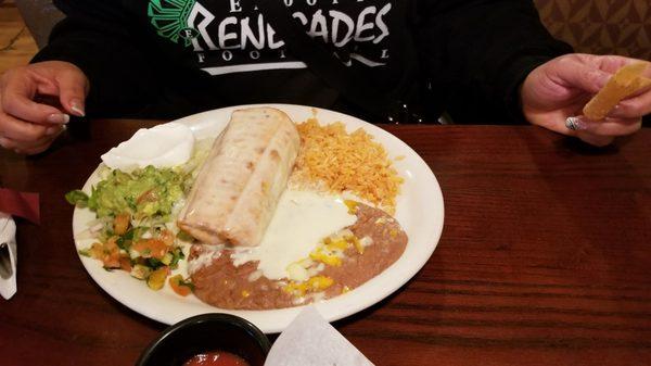 Beef Chimichanga with guac, rice, beans and sour cream