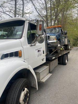 Towing my wrecker with my rollback.