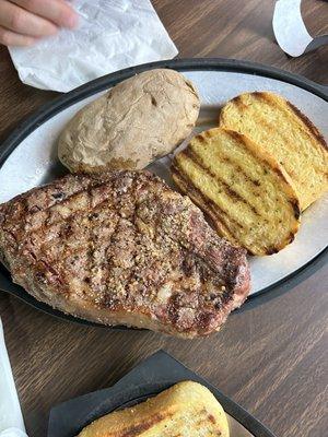 Ribeye, baked potatoes, 2 pieces of Texas toast