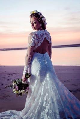 Happy bride wearing a custom made wedding lace dress from my studio.