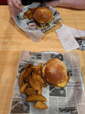 2 half pound cheese burgers with a side of fries