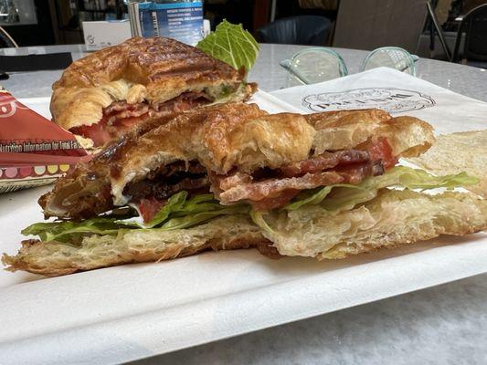 Mid-meal grilled BLT on a fresh croissant