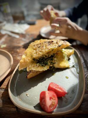 Egg and cheese with pesto