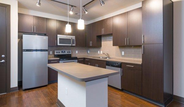 Designer cabinets, white quartz countertops and stainless steel finishes!