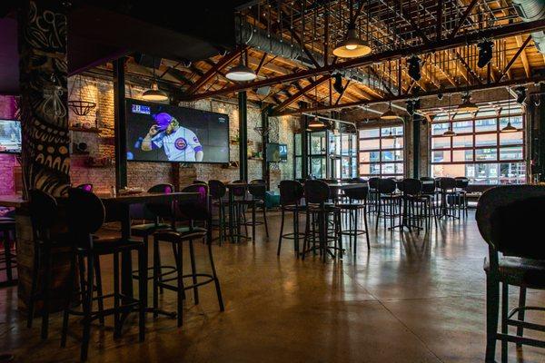 1st floor. Open garage doors and big tv screen.