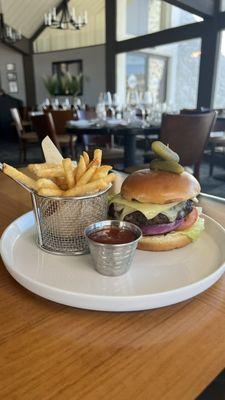 Short Rib Craft Burger served with grilled onion, romaine, tomato, bacon jam and gruyere on a brioche bun.