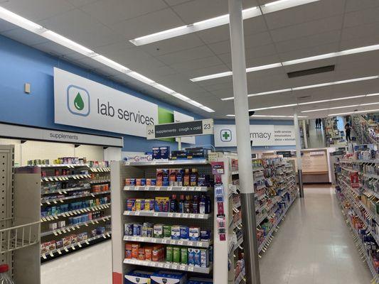 The different OTC  vitamins, and sellable items, and LabCorp in tucked away in the back left corner.