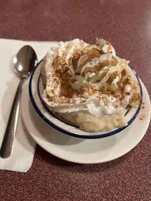 Homemade rice pudding with whipped cream and cinnamon sugar