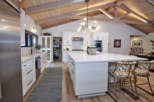 Open kitchen plan with wood ceiling and beams