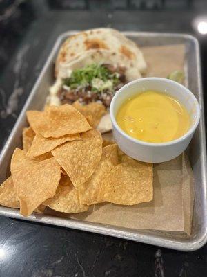 Queso and chips with tacos