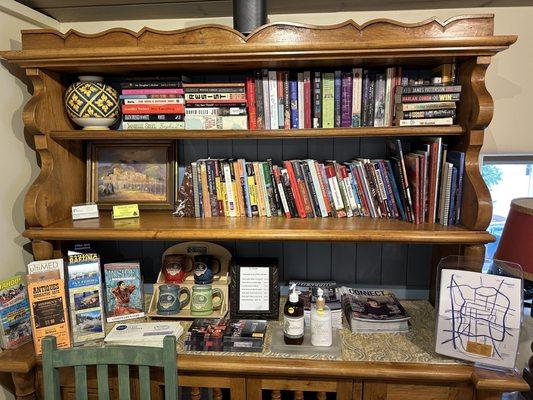 Breakfast area fliers and books patrons can borrow.