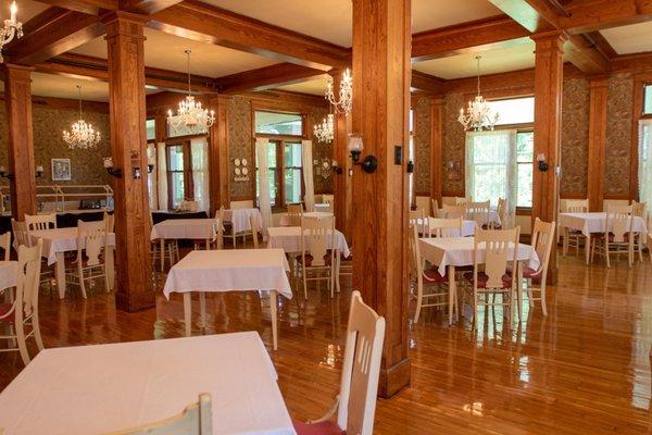 Our dining room is 2,000 sq ft with original beams and 110 yr old windows with wavy glass, maple floor and austrian glass chandeliers