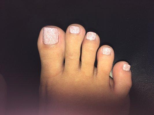 Regular pedicure. Light pink sparkle color. Look a lot better in person. The light on my phone doesn't capture this well