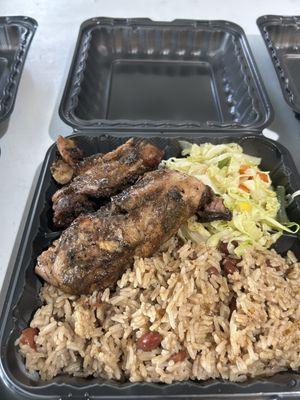 Jerk Chicken w/ rice& peas and steamed cabbage