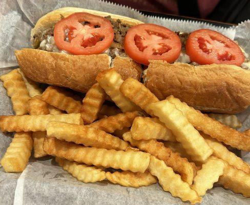 Cheese steak sub with fries