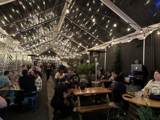 Outdoor seating area is resplendent with lights