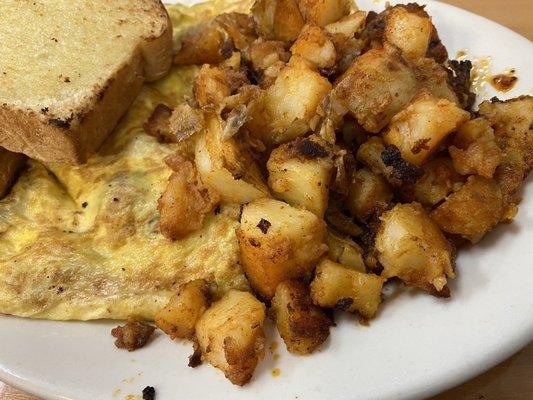 Meat lovers omelet, home fries, homemade white toast!