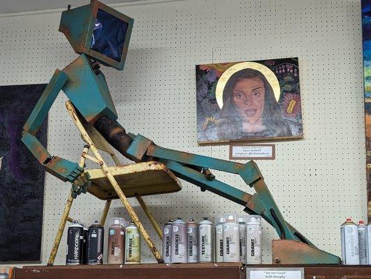 lounging robot sculpture "404 not found" by Kelli Murphy at Carter Sexton art supplies