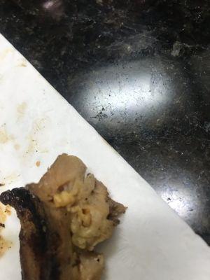 Chicken with what looks like a worm?