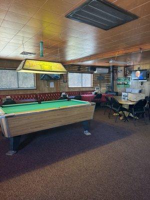 Pool table and seating area a plenty.